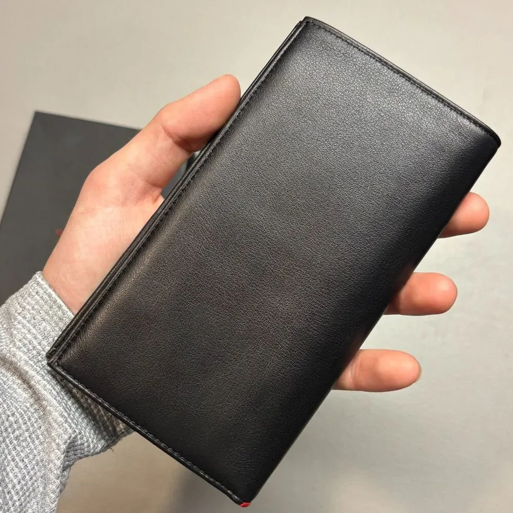 Tumi global leather
