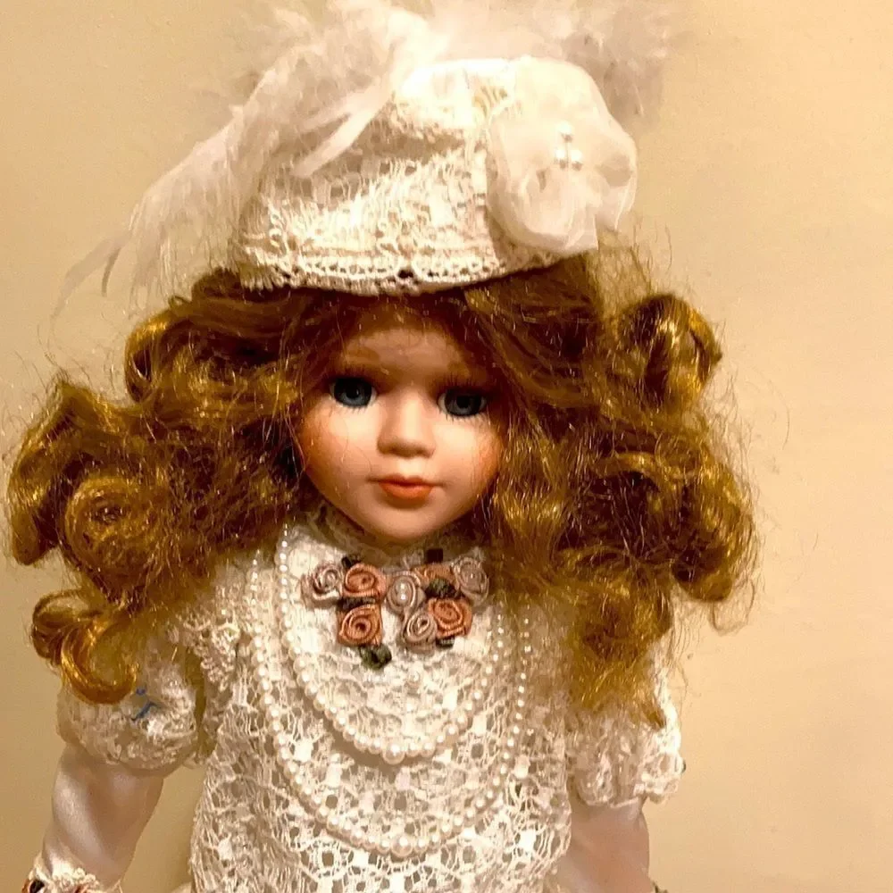 Porcelain doll with satan and lace trim dress with umbrella 15 inches