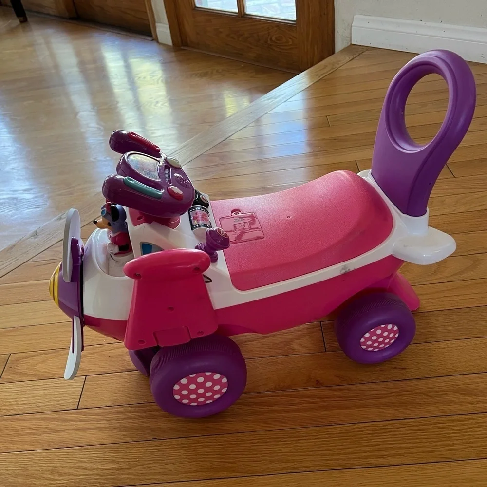Disney’s Minnie airplane Pink + Purple Ride-On Airplane Toy