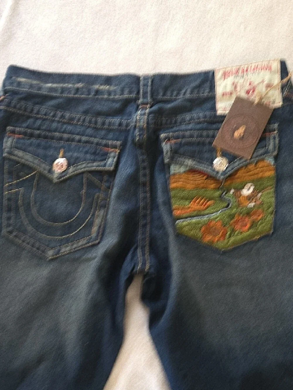 True Religion button rivet detail
