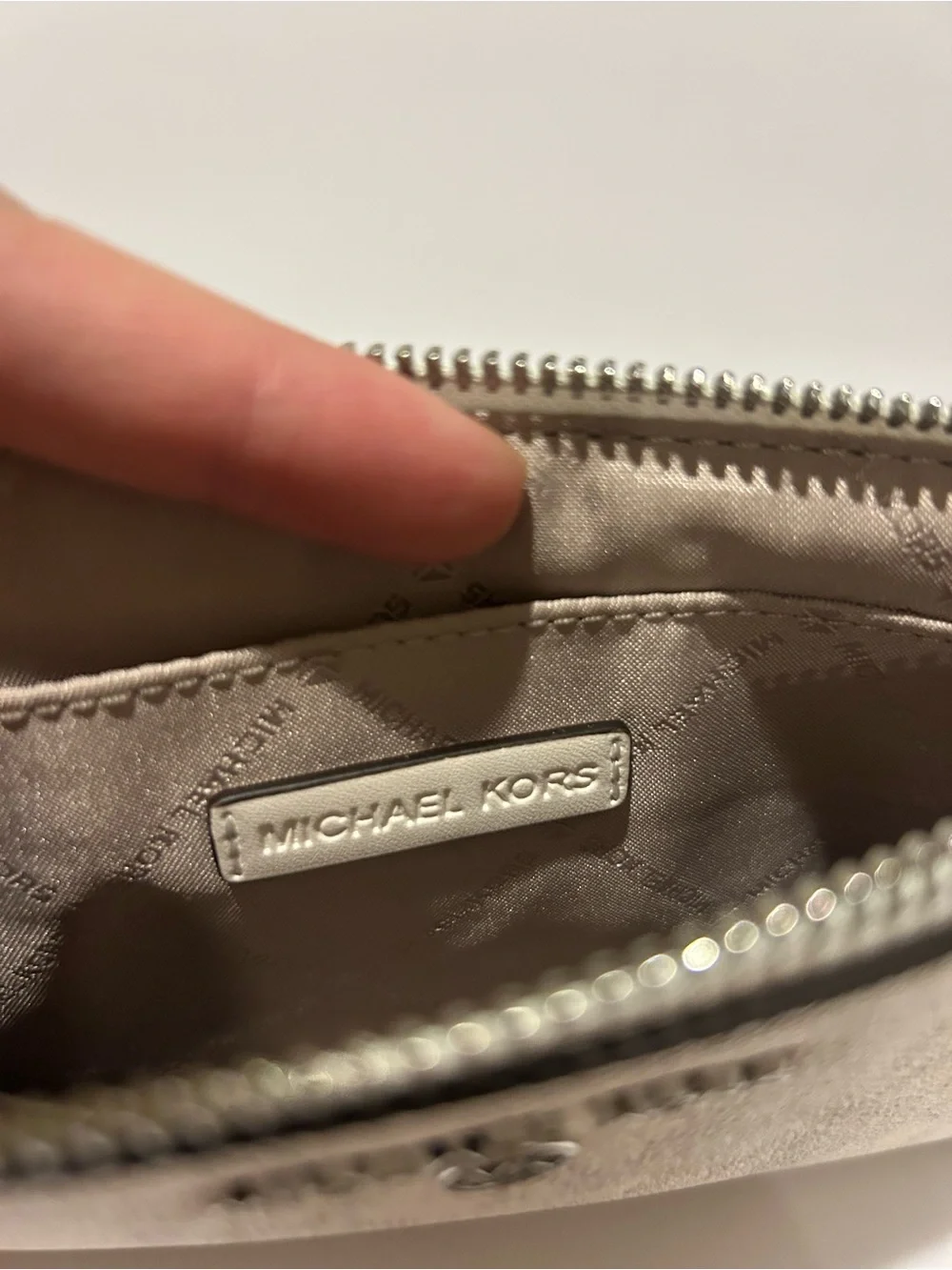 Michael Kors Cream Signature Wristlet with Tassel Charm