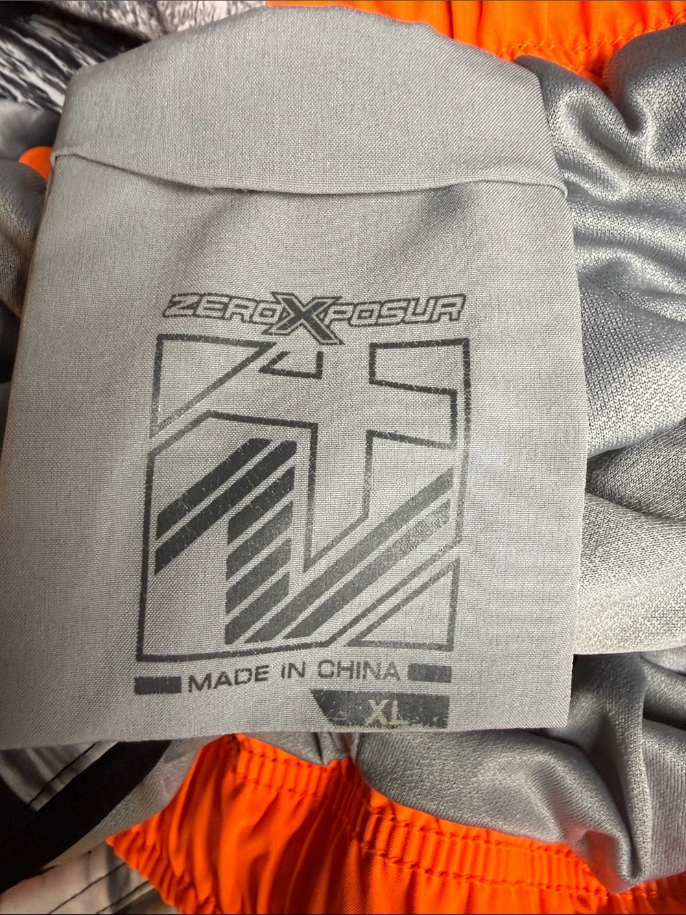 ZeroXposur Men's Black & White Graphic Swim Trunks with Orange Accents Size XL