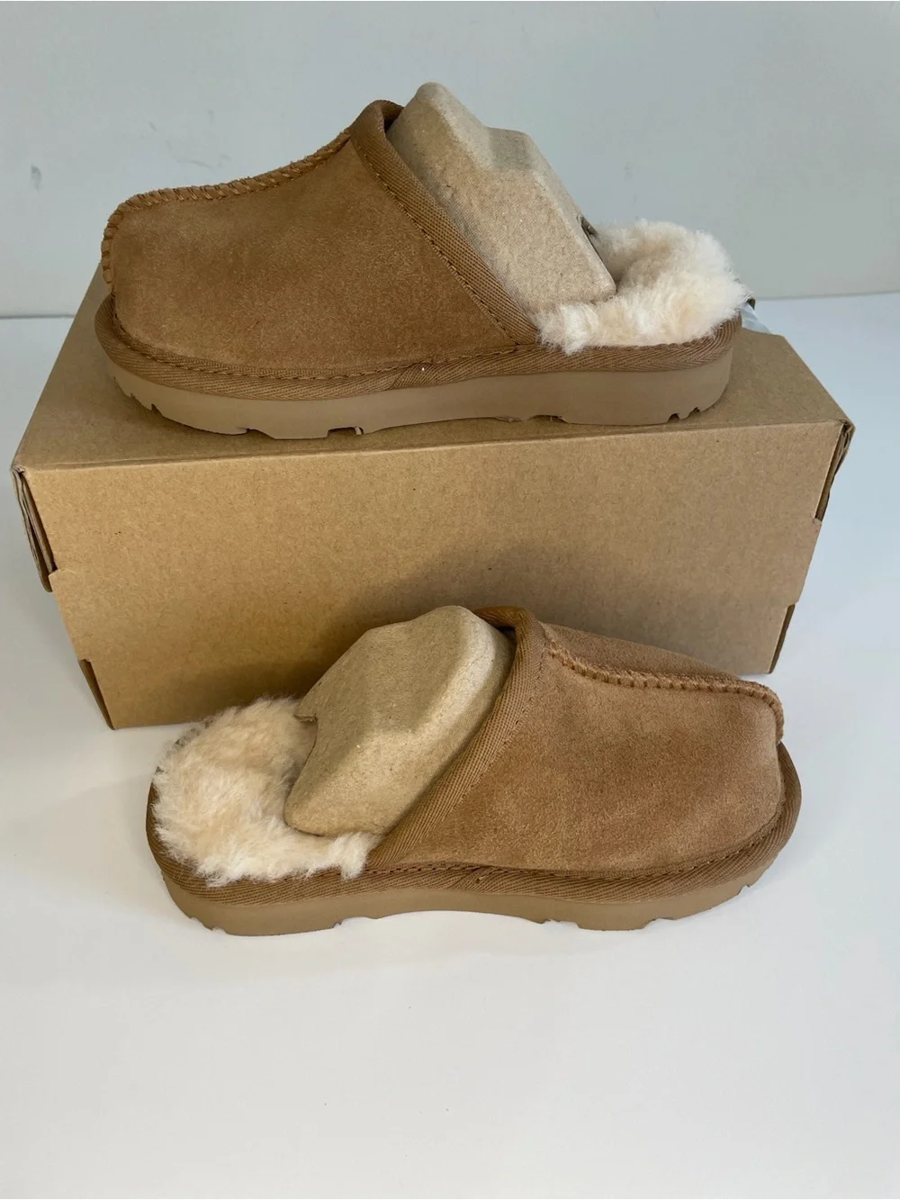 UGG slide shearling feet