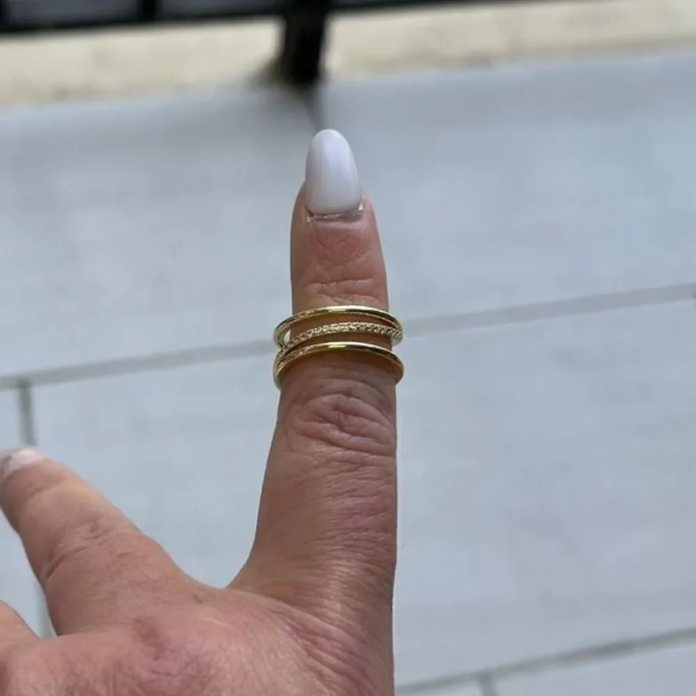 The Triple Bling Ring adjustable in 14k gold over 925 with cubic zirconia