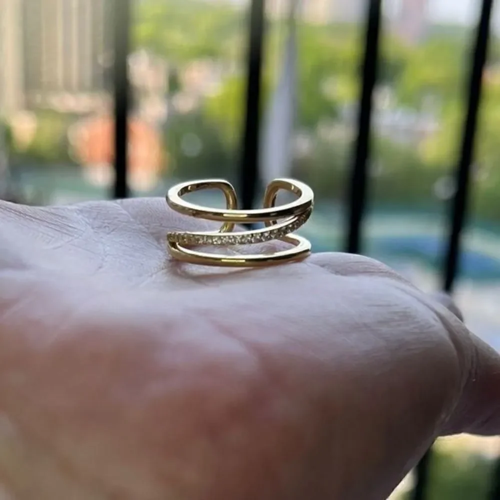 The Triple Bling Ring adjustable in 14k gold over 925 with cubic zirconia