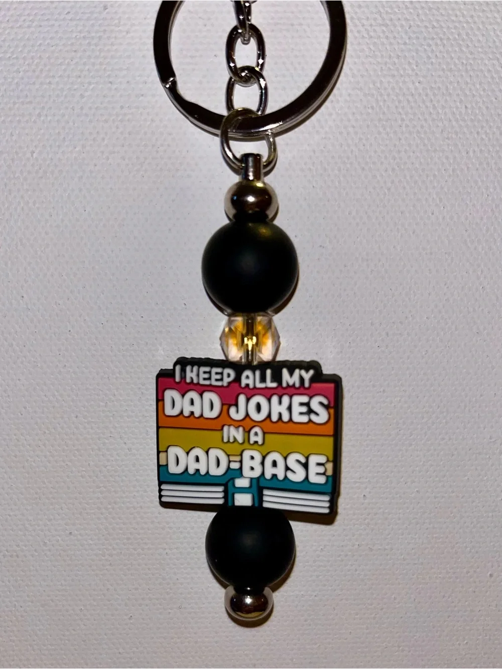 ‘I Keep All My Jokes in a Dad-Base’ Black with Retro Stripes Keychain