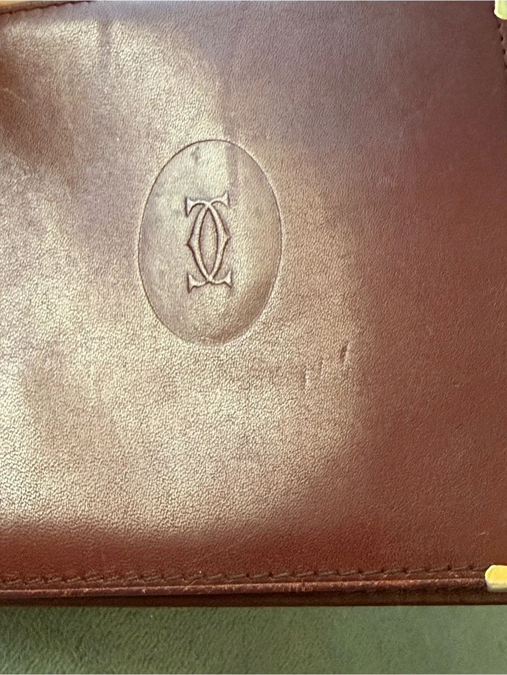 Cartier Burgundy Leather Bi-Fold Wallet with Gold Corner Hardware