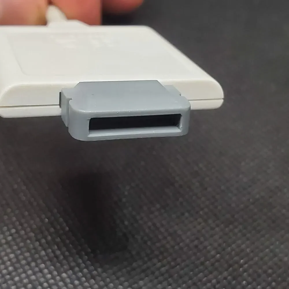white adapter cable for the Xbox 360 console
