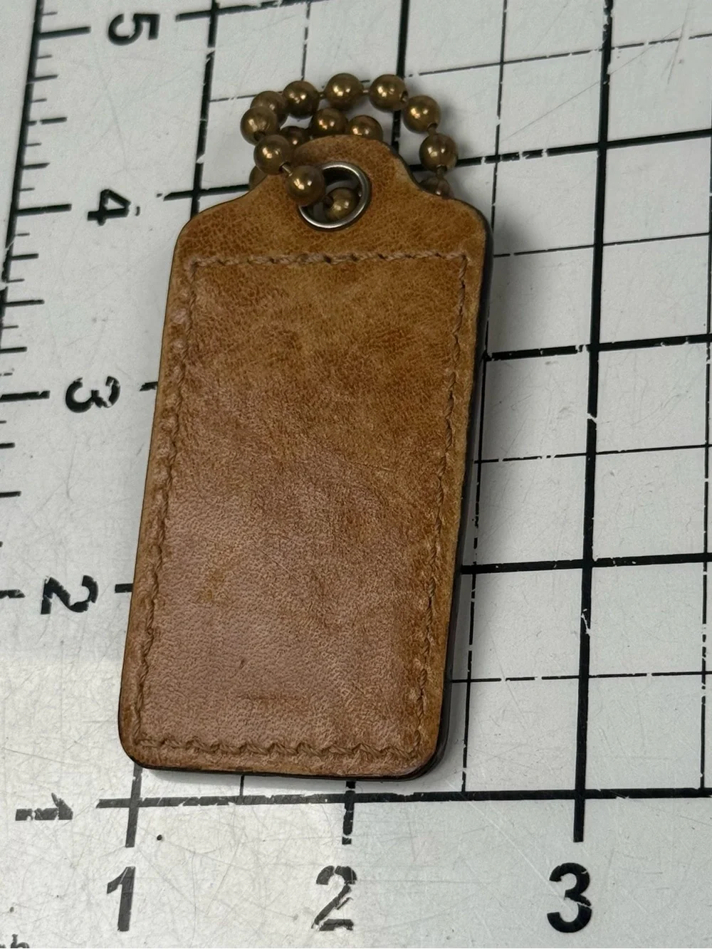 COACH Tan Leather Key Tag hang tag with Brass Ball Chain. Lg. 3 by 1.25 inches