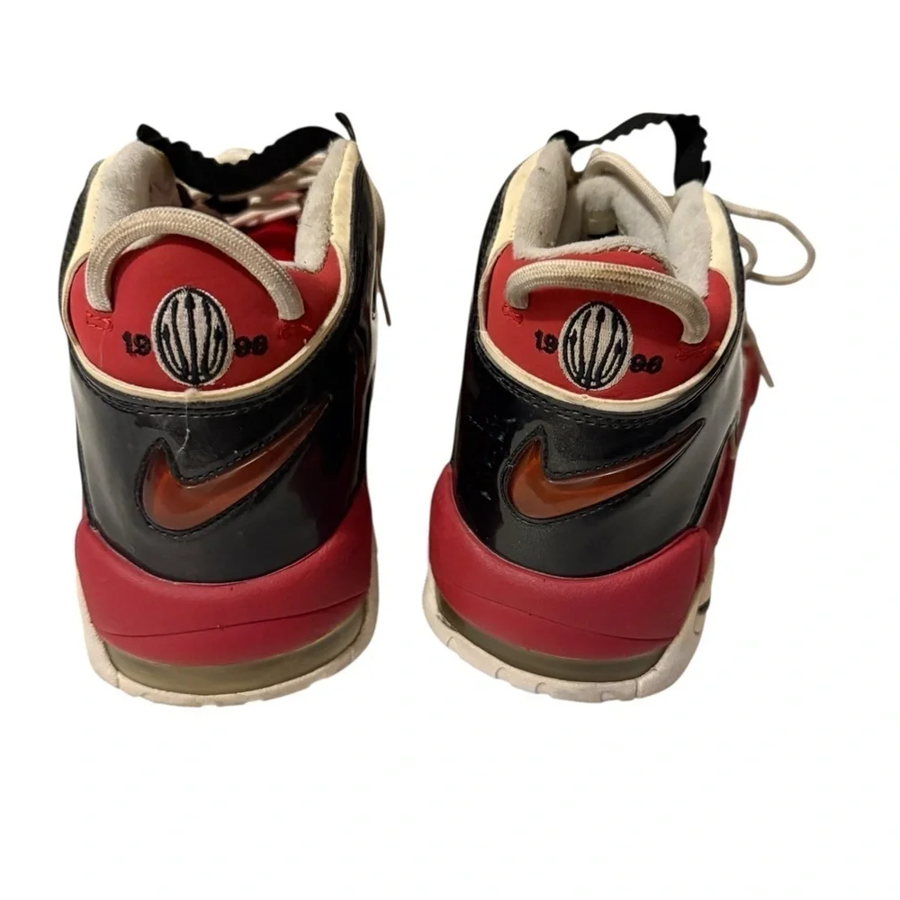 This is a pair of Nike Air More Uptempo '96 basketball shoes in a red, black.