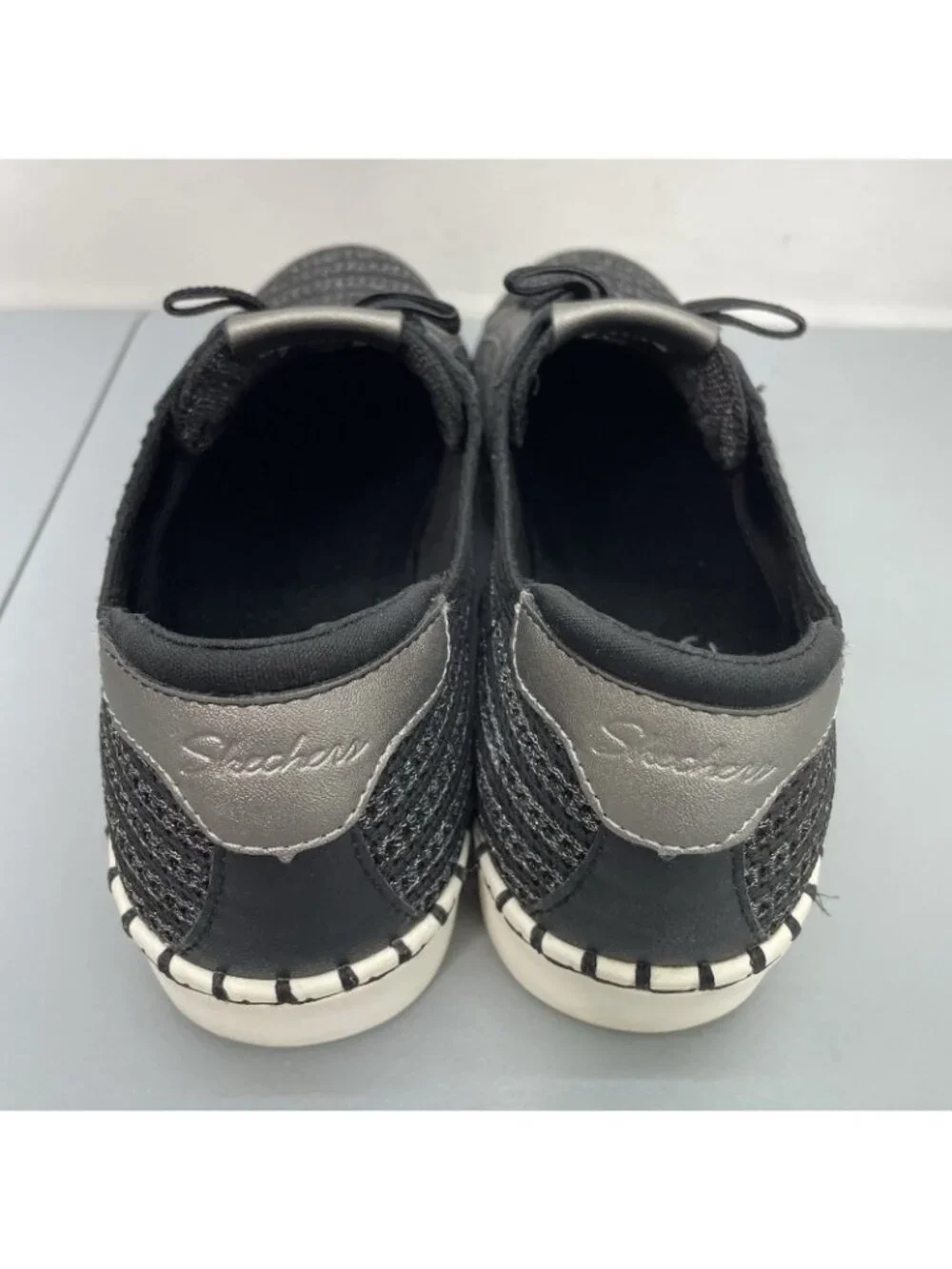 Skechers silver imperfections signs