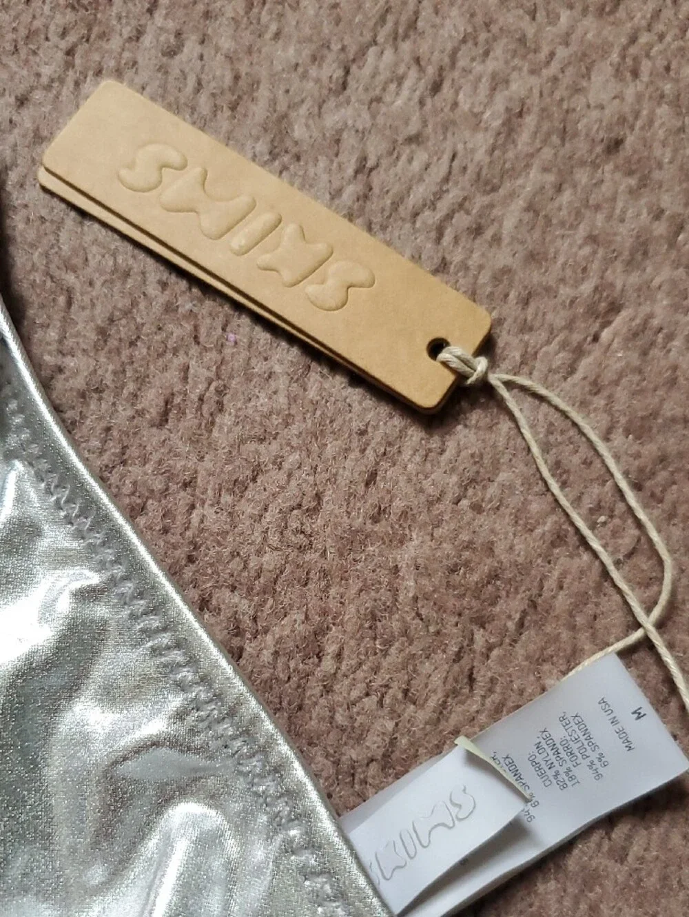 SKIMS shiny triangle