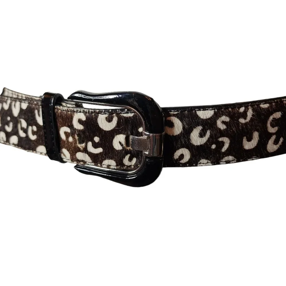 100% calf hair leather‎ dark brown, white spotted belt.