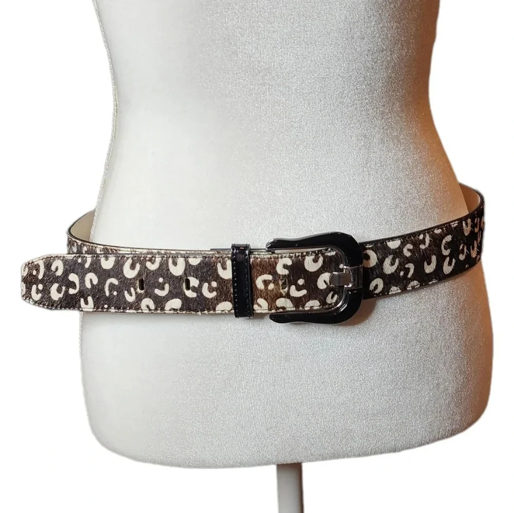 100% calf hair leather‎ dark brown, white spotted belt.