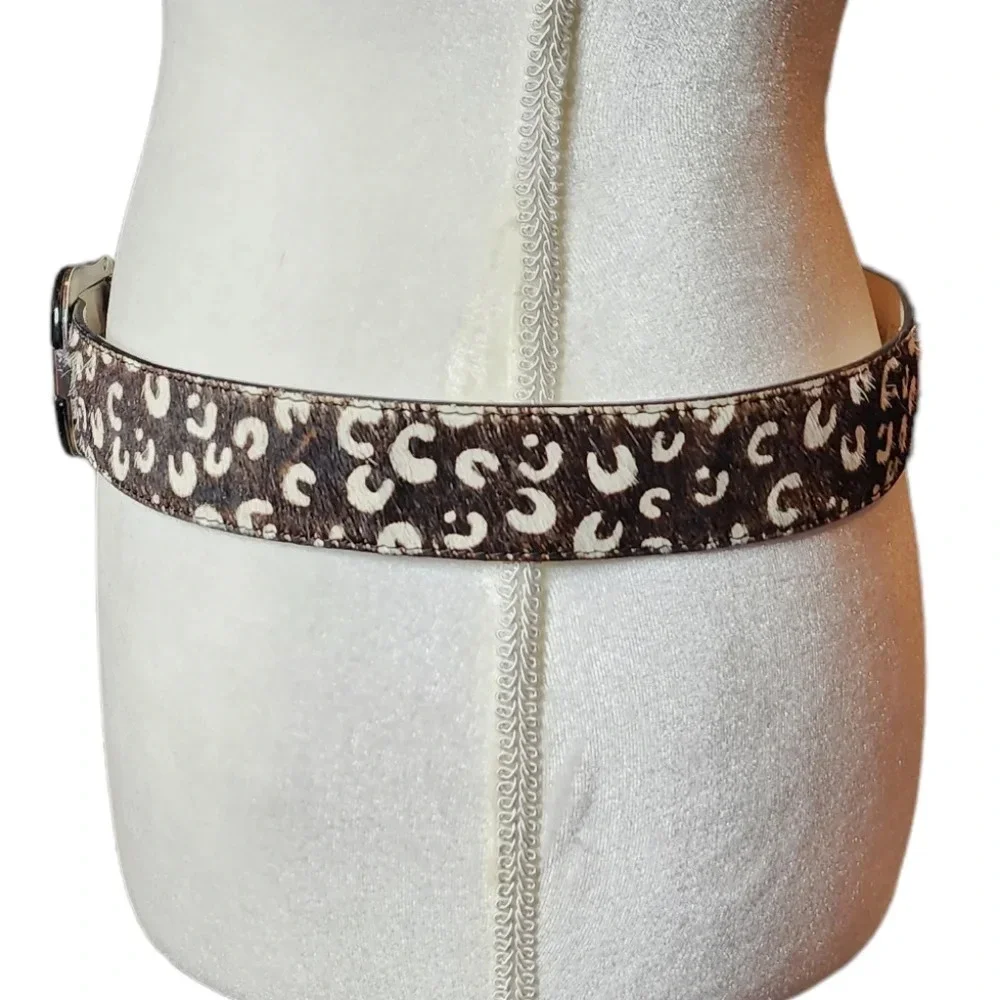 100% calf hair leather‎ dark brown, white spotted belt.