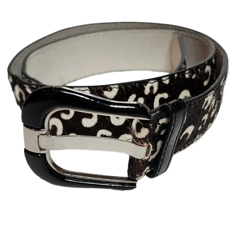 100% calf hair leather‎ dark brown, white spotted belt.