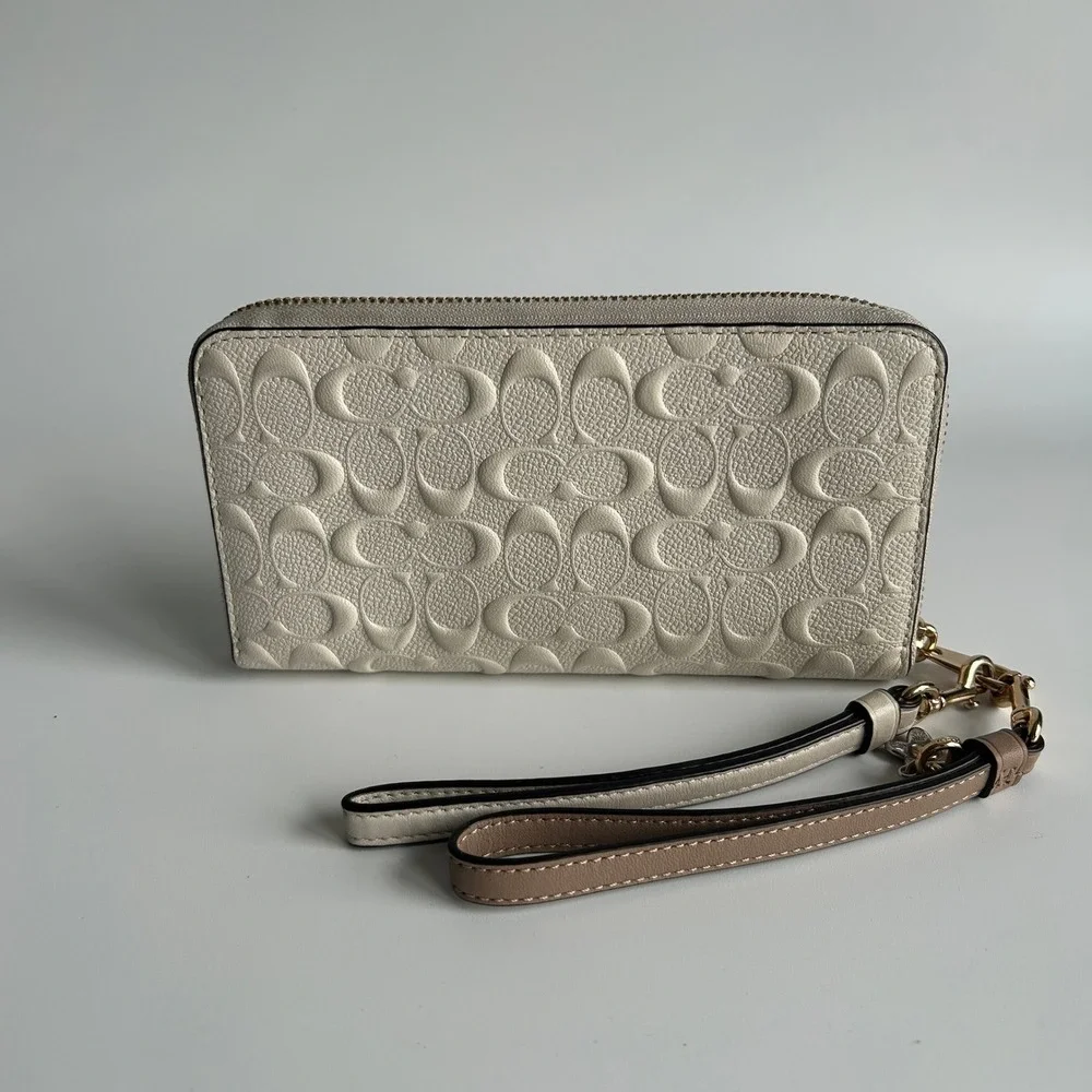 Coach Signature Embossed Chalk White Pebbled Leather Wristlet Excellent