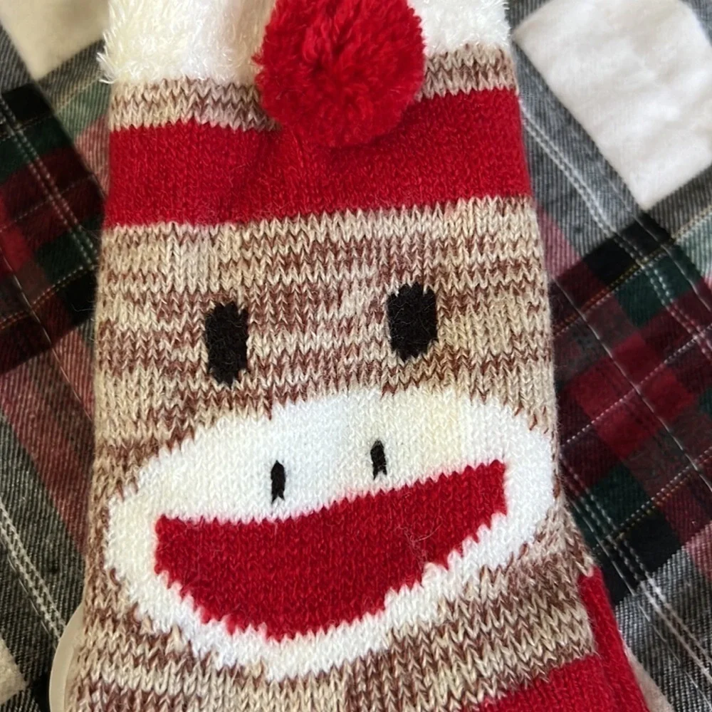 The sock monkey has rubber on the bottom for slip resistant.-Copy