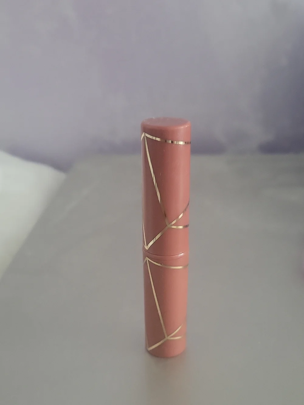 Aura Nude Pink Lipstick Tube with Gold Accents