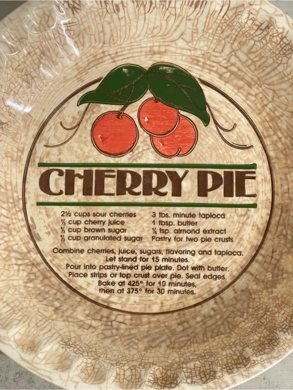 Crazed and stained cherry pie plate