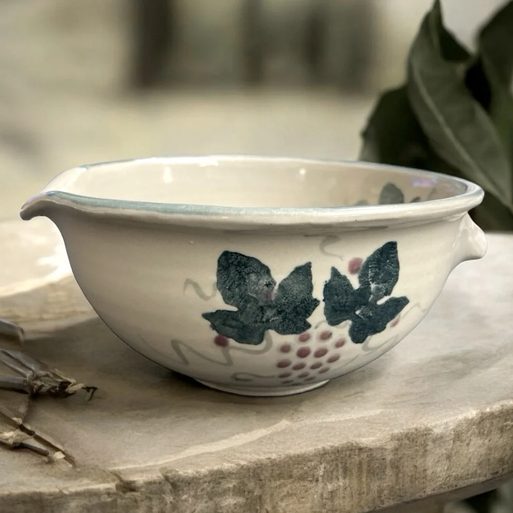 Handmade Bowl w/ Grape vines/ leaves. Singed by artist. Handle/ lip for pouring
