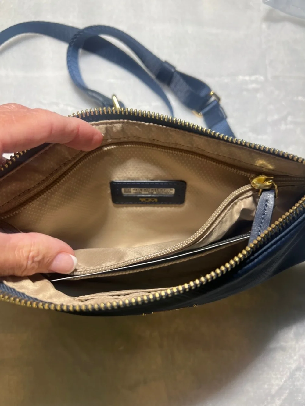 Tumi compact crossbody