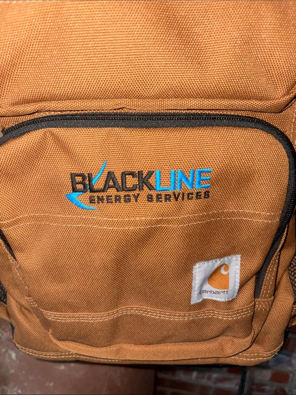 Carhartt Brown Canvas Backpack with Black Trim and Blue Logo