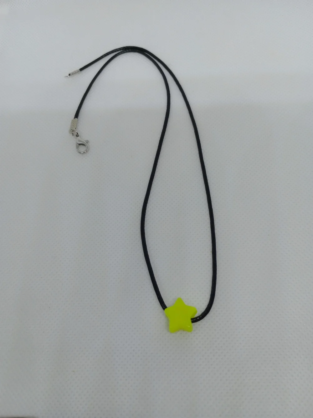 Neon Yellow Star Pendant Necklace on Black Cord