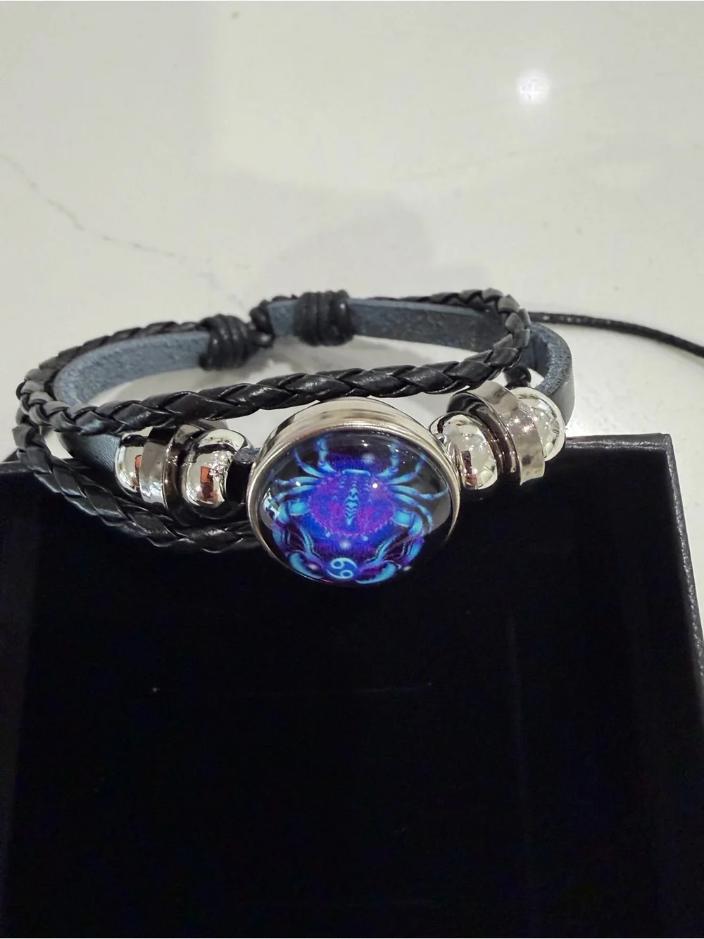 Spirilet Zodiac Black Braided Leather Bracelet with Blue Iridescent Cabochon