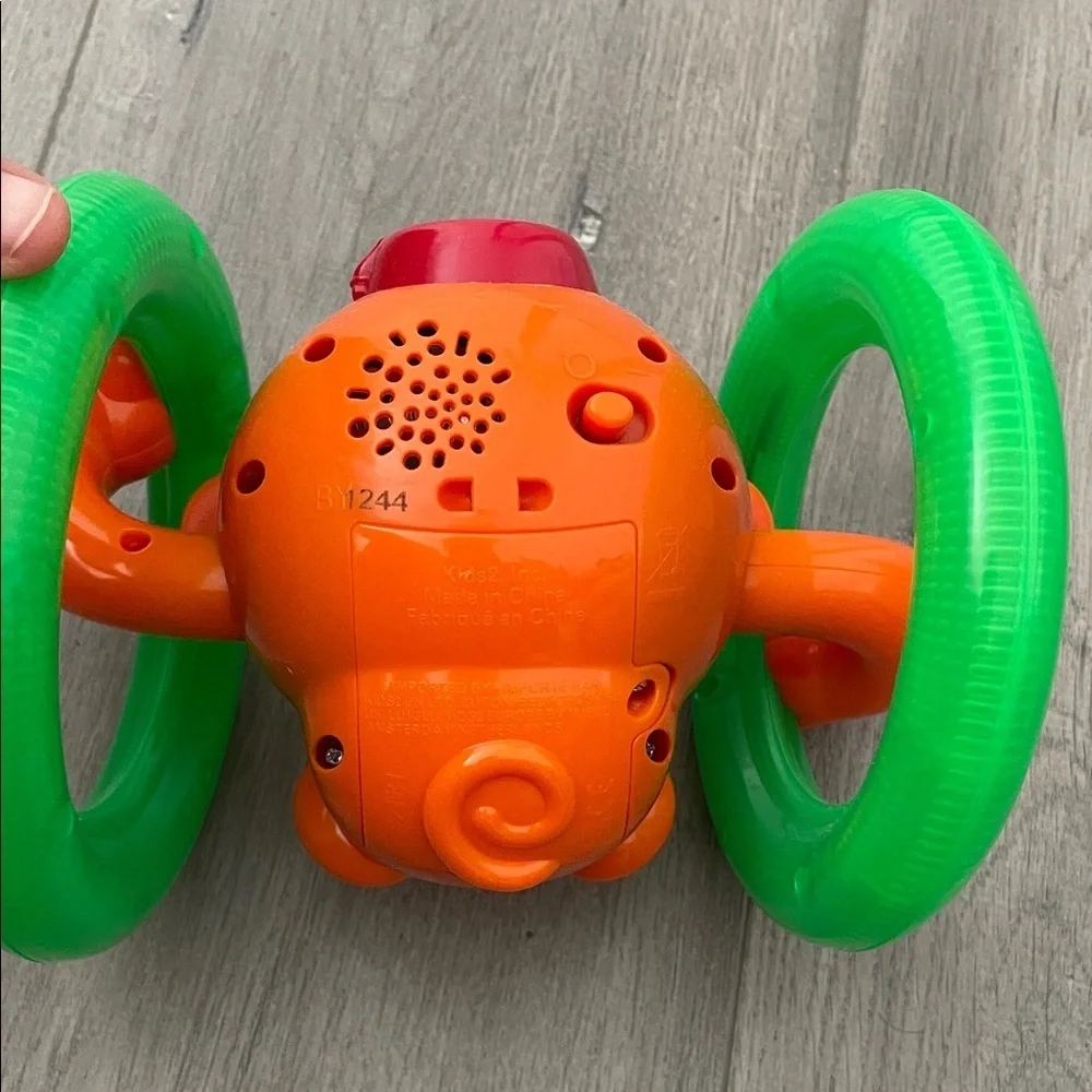 Orange and Green Monkey musical light up tummy time toy