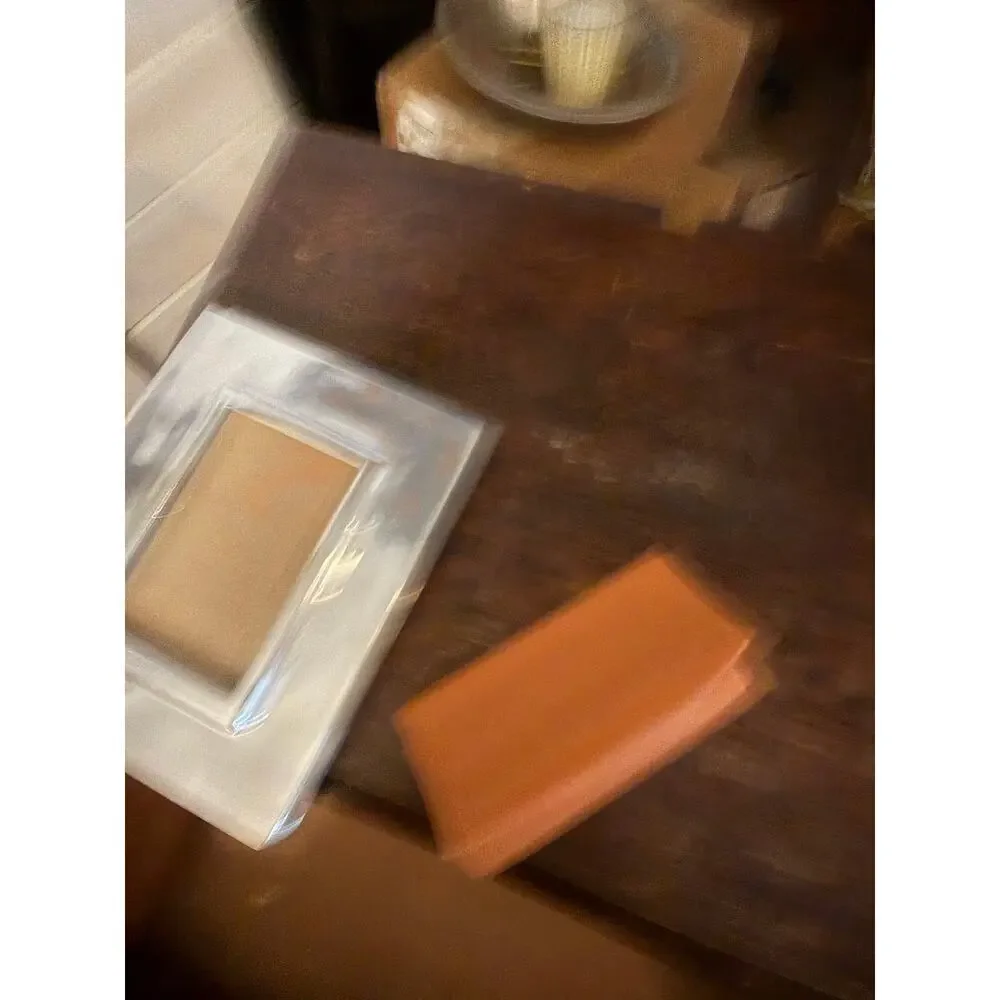 Tory Burch raised burch envelope