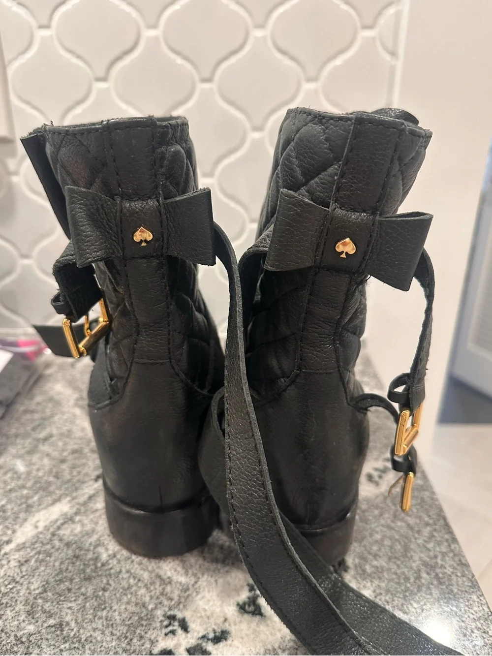 kate spade Black Quilted Leather Ankle Booties with Bow and Gold Spade Hardware