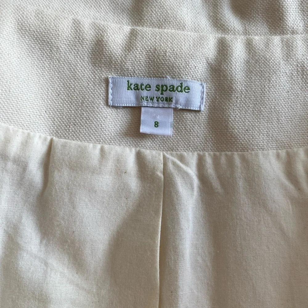 Kate Spade- NWOT Ivory Canvas Cropped Jacket with Red Piping Trim