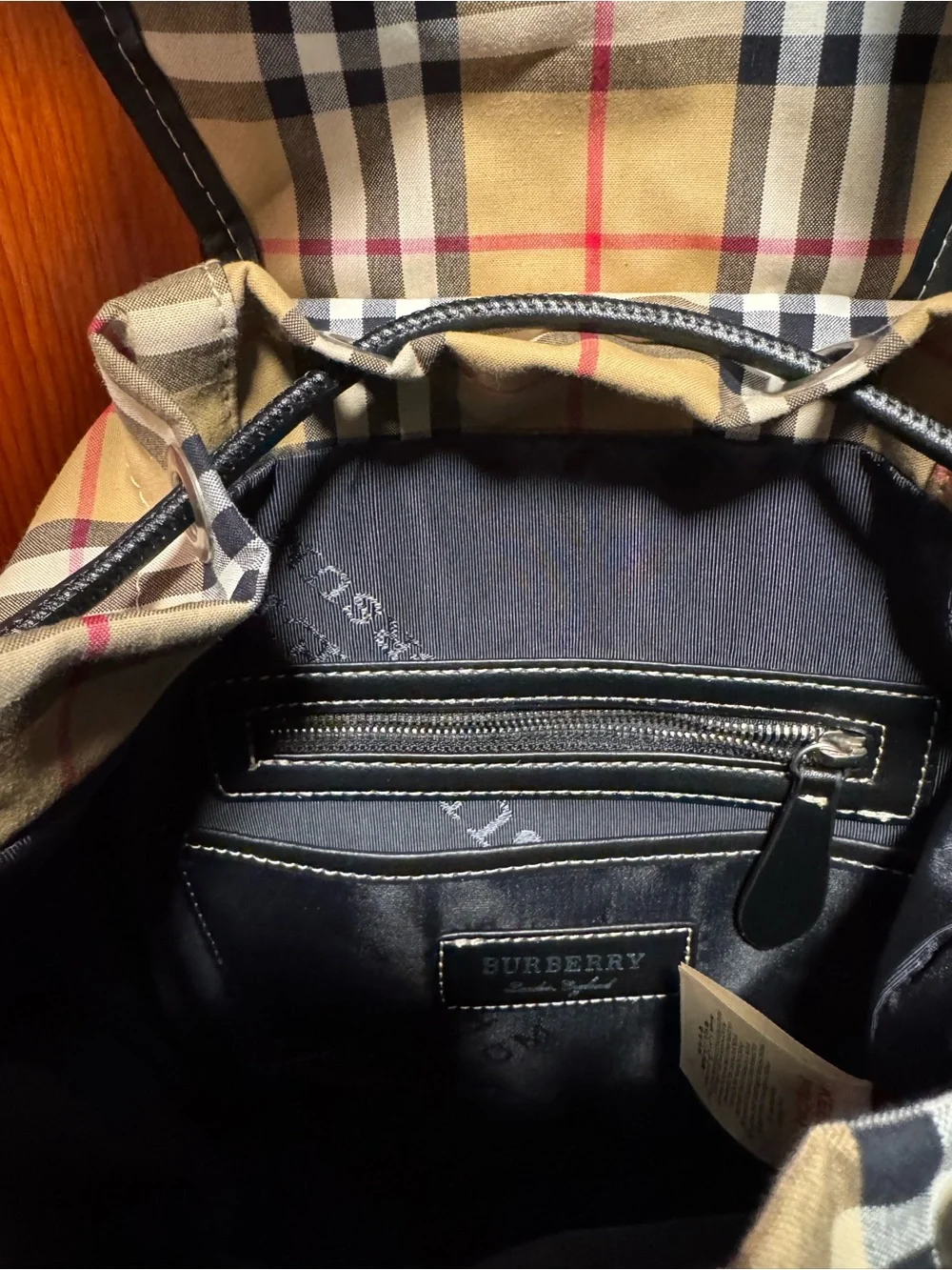 Burberry Nova Check Backpack with black trim and top handle excellent condition