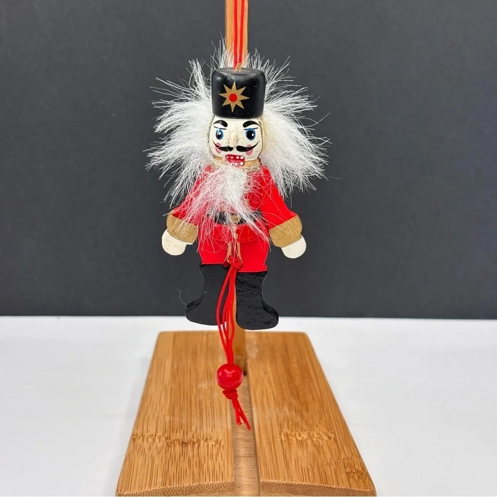 Vtg wood articulating pull string nutcracker & (1) Plastic Nutcracker Ornament