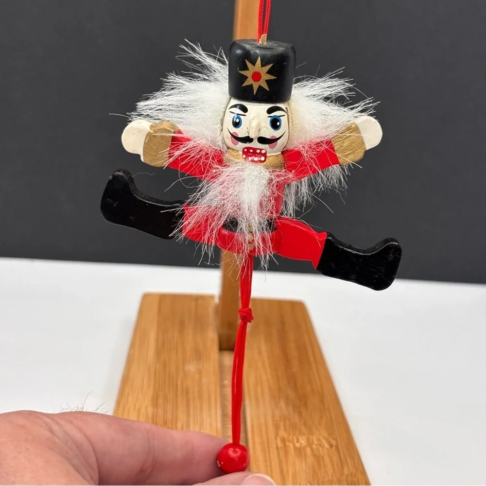 Vtg wood articulating pull string nutcracker & (1) Plastic Nutcracker Ornament