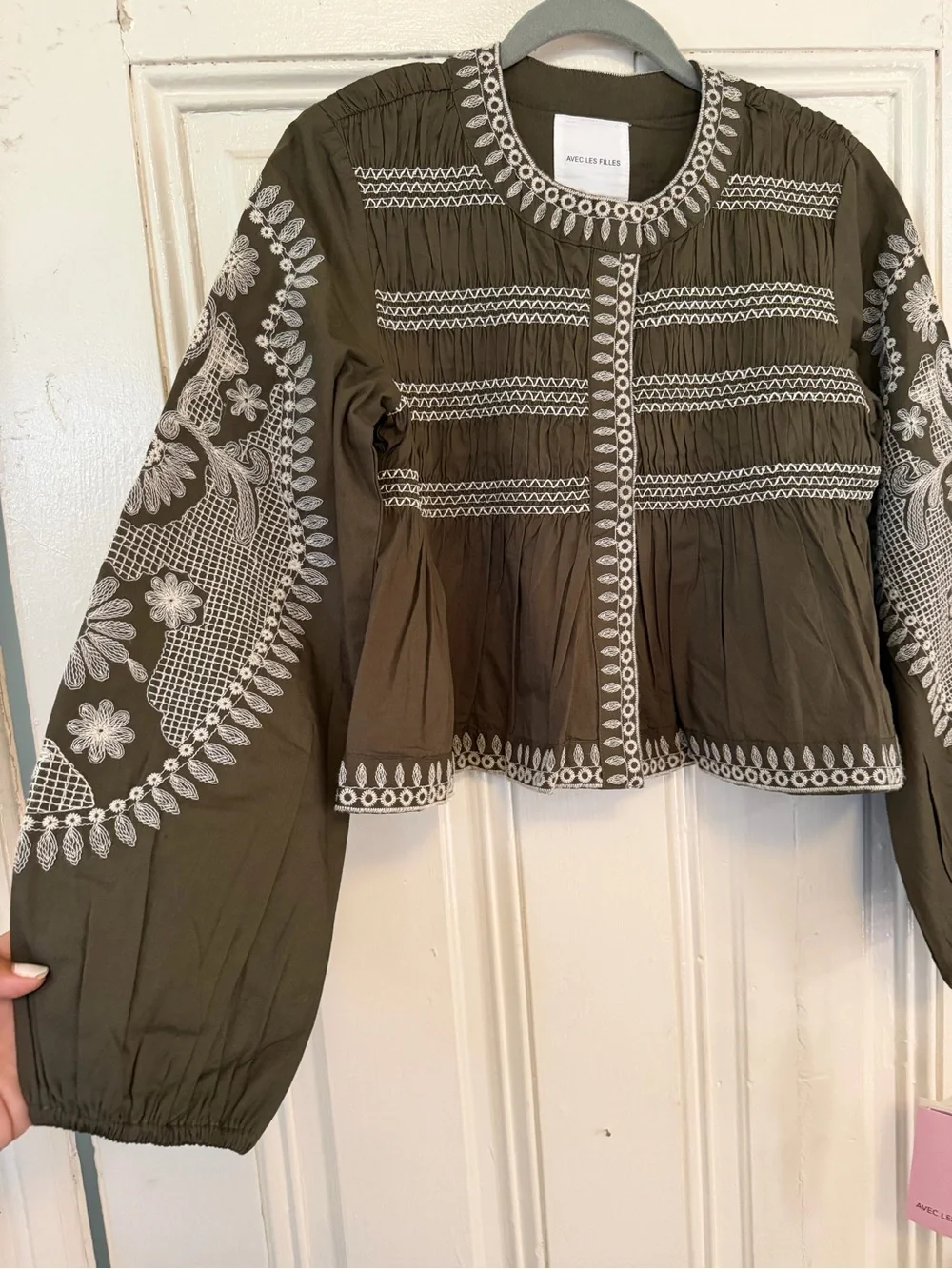 Anthropologie peplum embroidery features