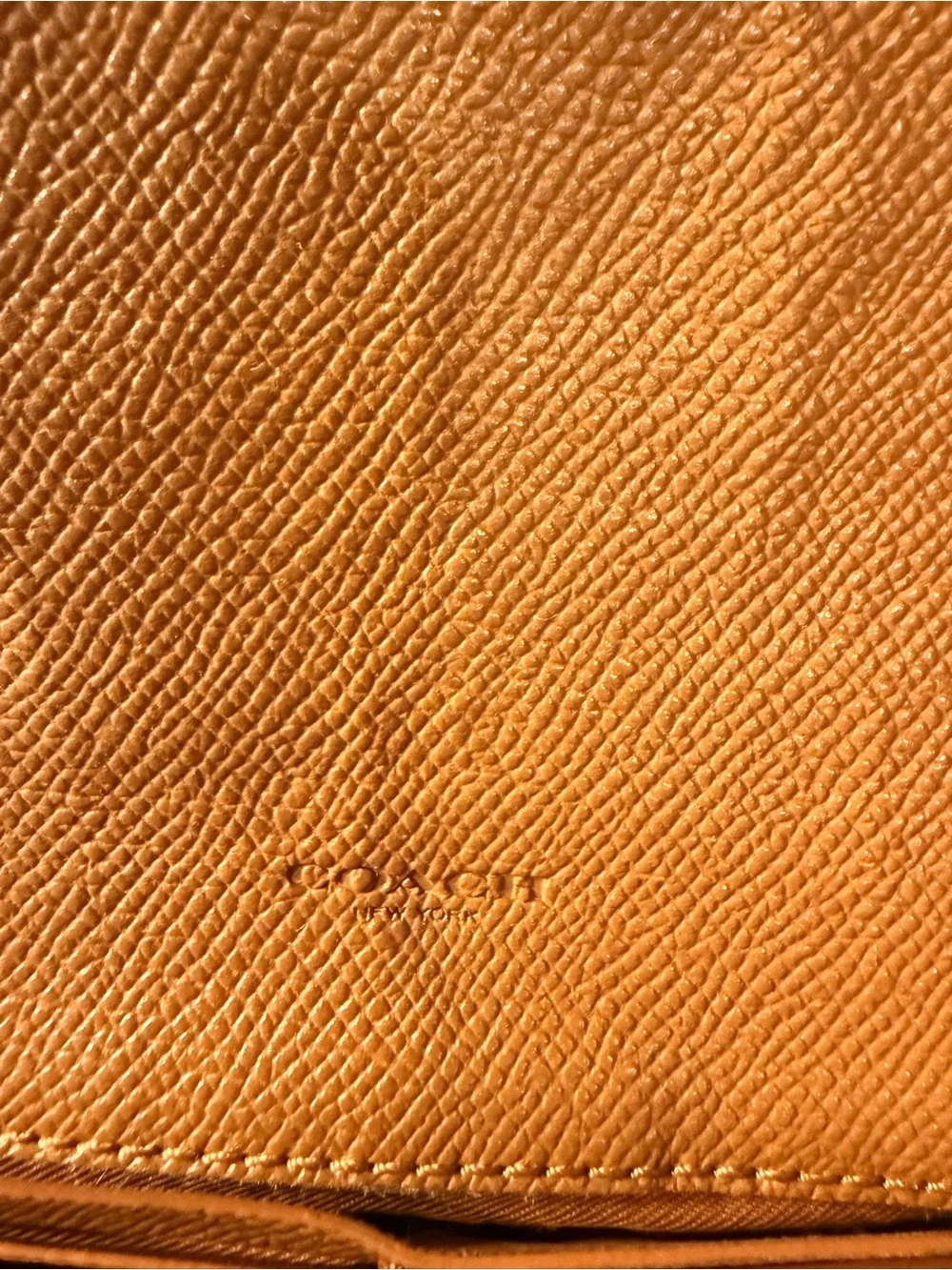 Coach compact pebbled