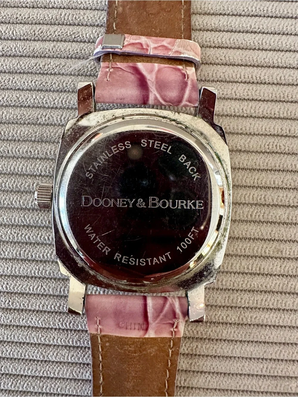 Dooney & Bourke stainless embossed genuine