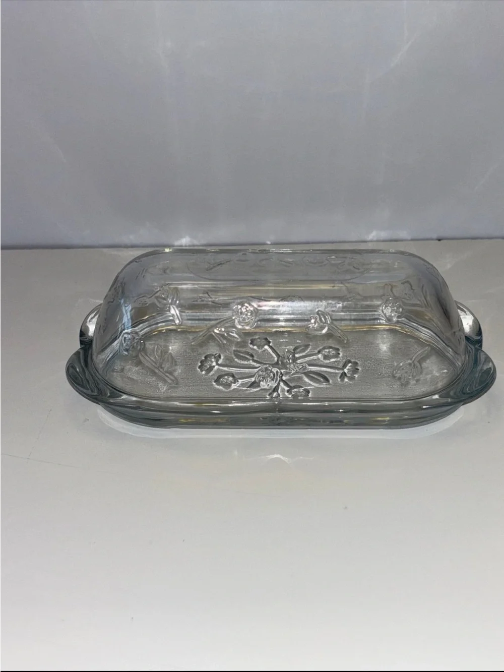 Anchor Hocking Savannah butter dish features a pressed clear glass design flower