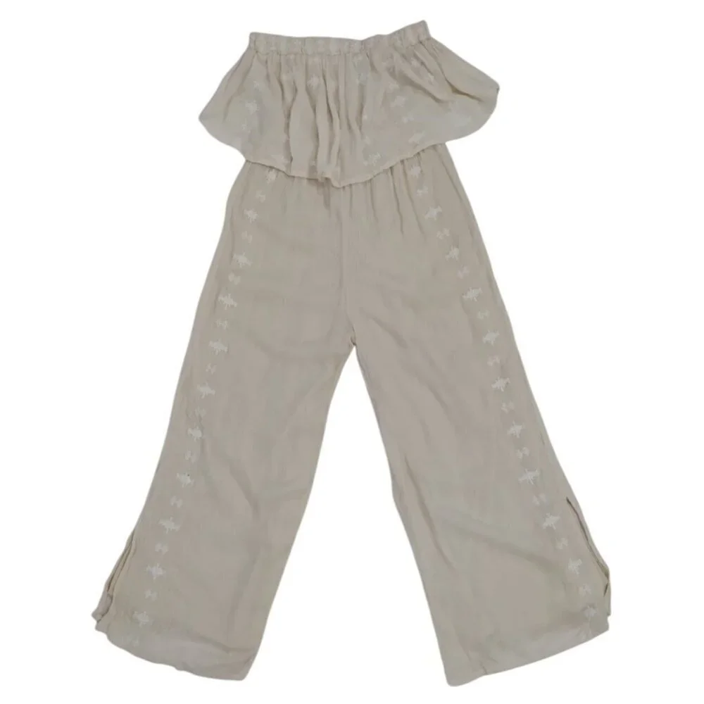 Women's beige offthe-shoulder ruffle jumpsuit with embroidered detail, wide leg