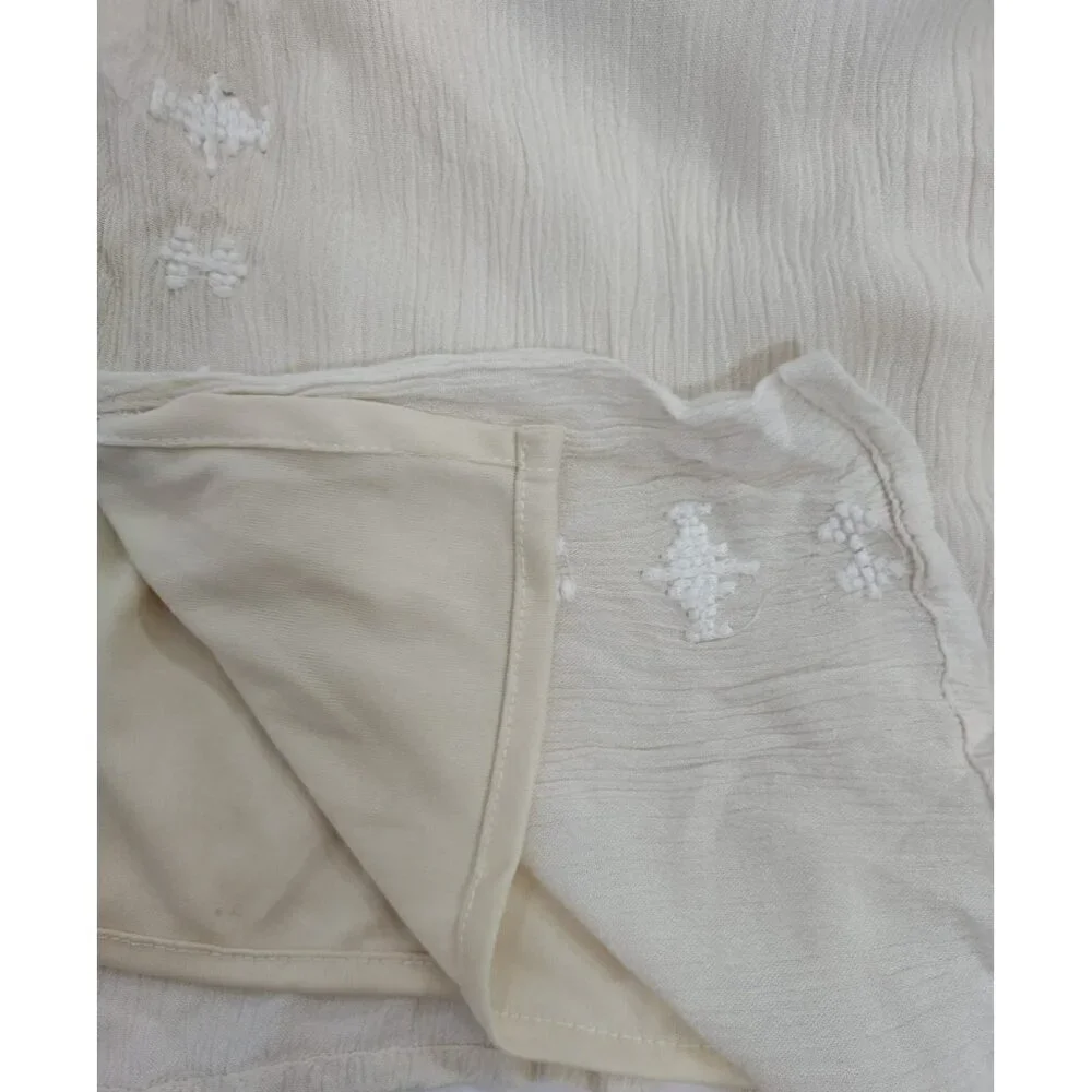 Women's beige offthe-shoulder ruffle jumpsuit with embroidered detail, wide leg