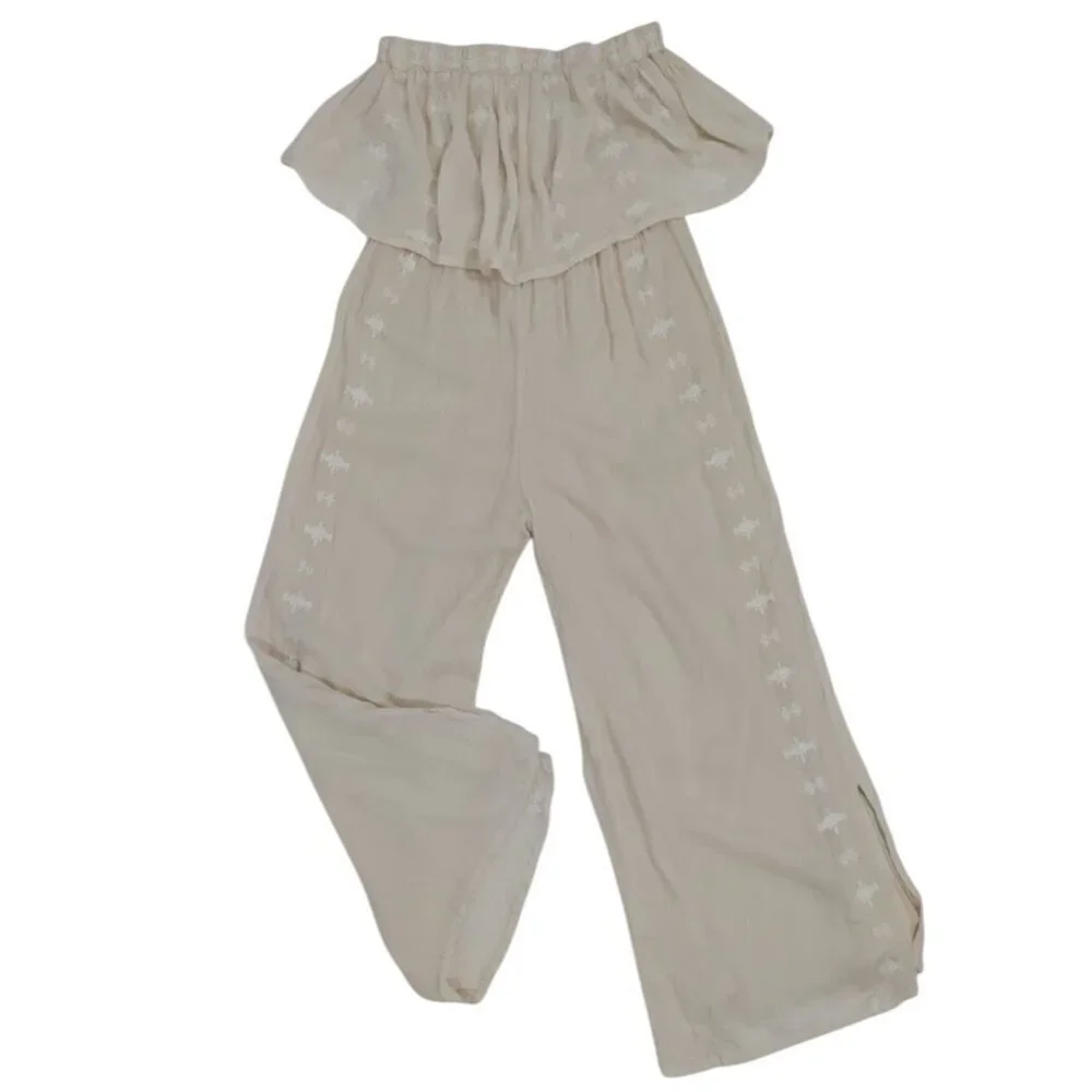 Women's beige offthe-shoulder ruffle jumpsuit with embroidered detail, wide leg