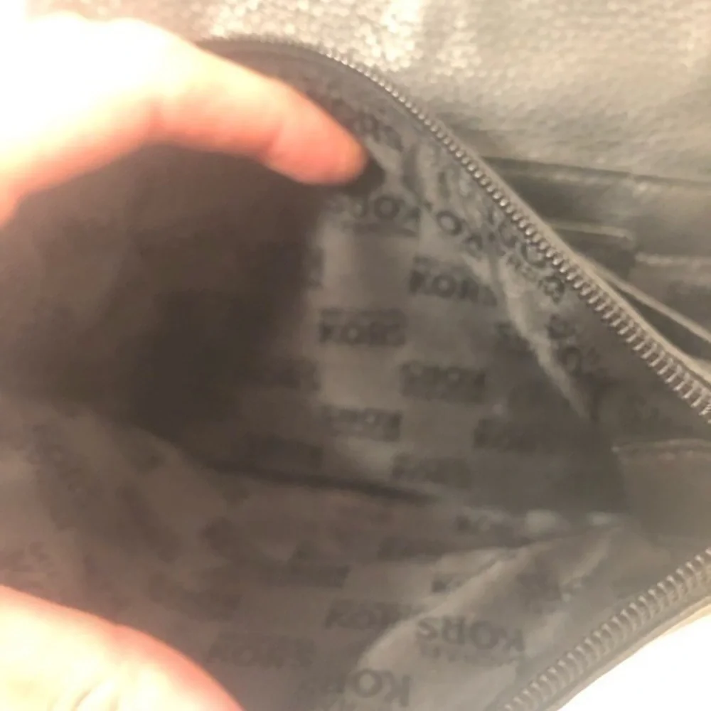 Michael Kors scratches logo