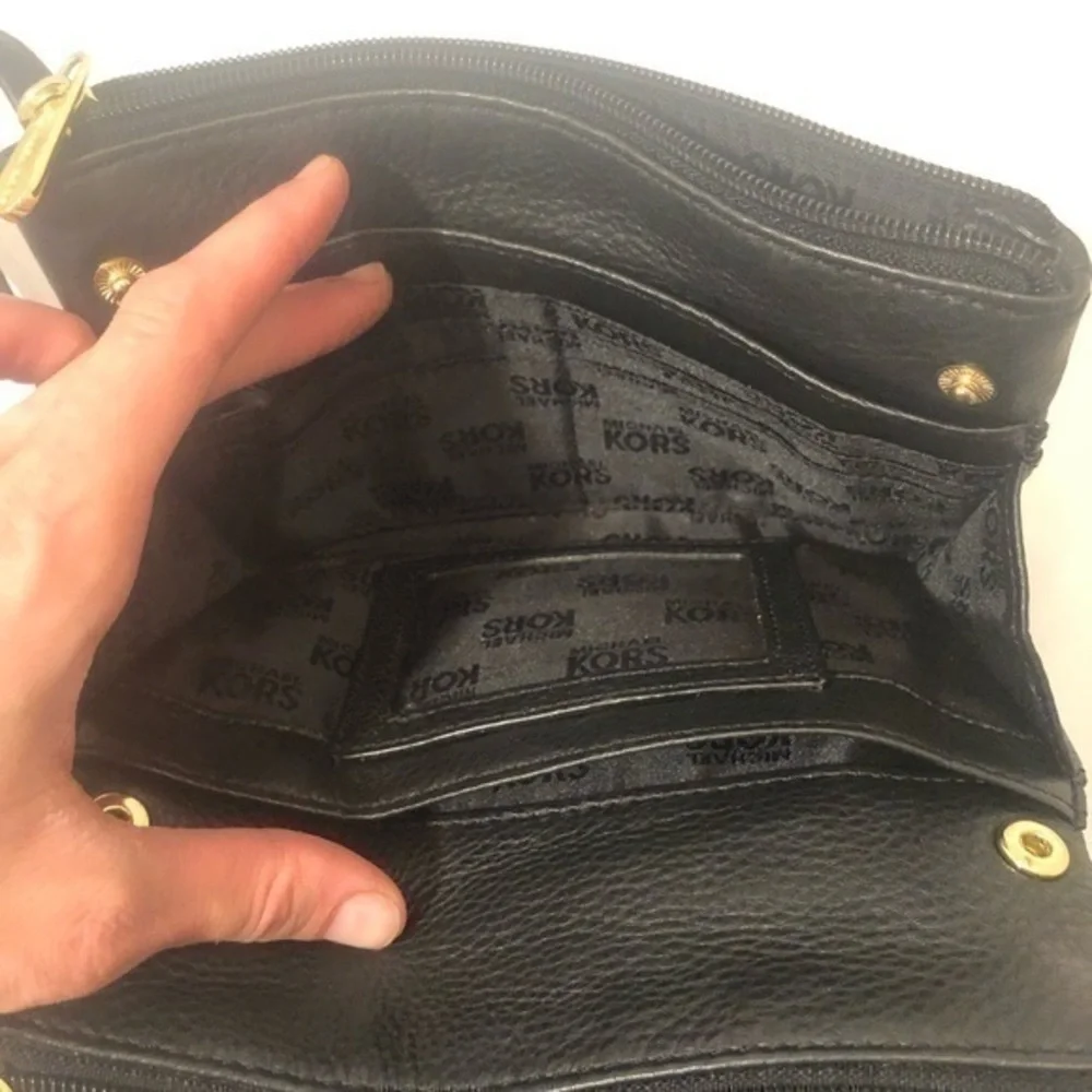 Michael Kors scratches logo