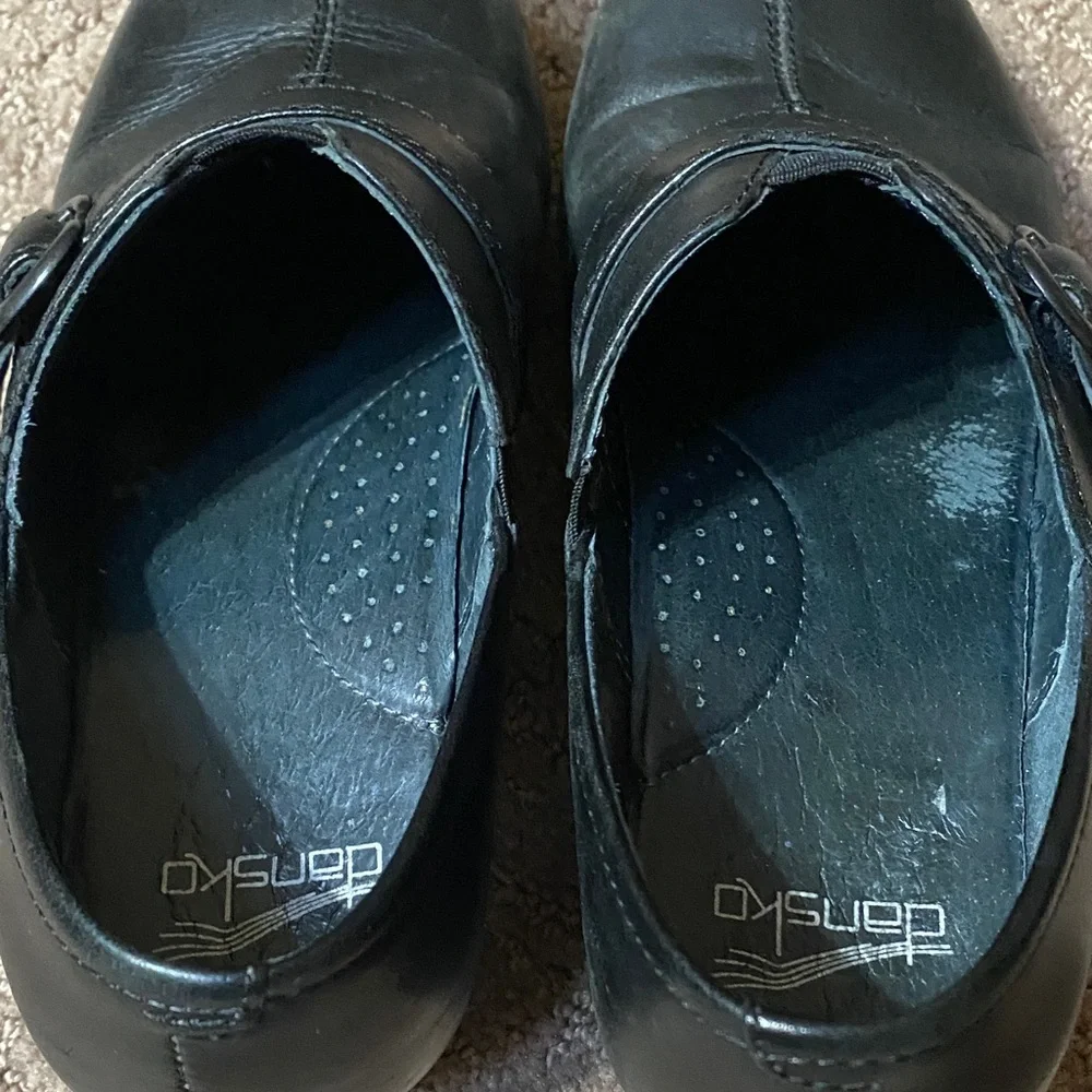 Dansko Black Leather Slip-On Size 36 (6) Loafers with Buckle Accent Clogs