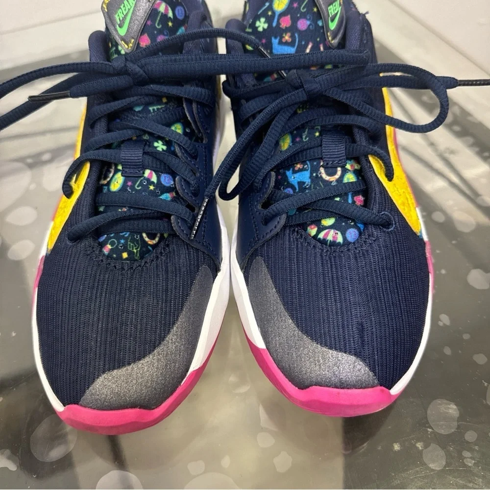 Nike Kids Navy Sneakers with Pink and Yellow Accents