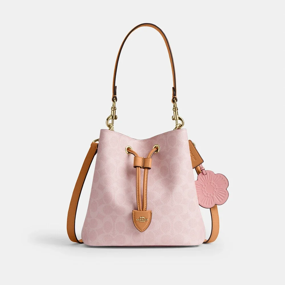 Coach Outlet Rowan Bucket Bag In Signature Canvas With Charms
