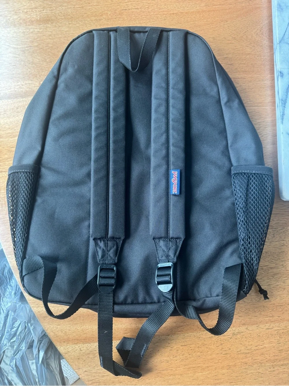 Jansport Black Backpack with Blue Logo Patch
