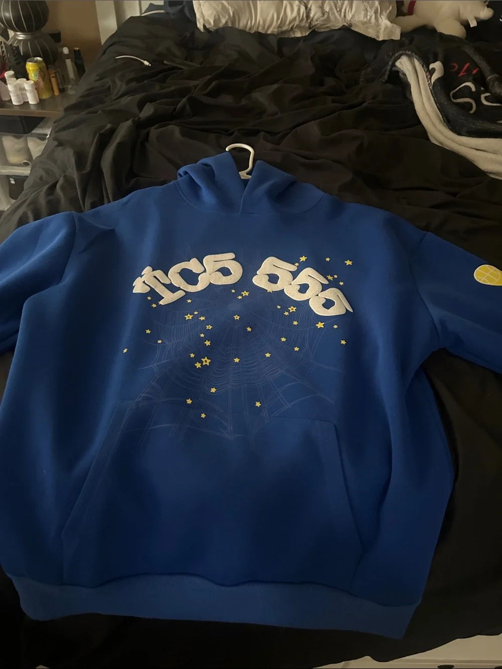 Blue Graphic Hoodie with White Logo and Yellow Star Details